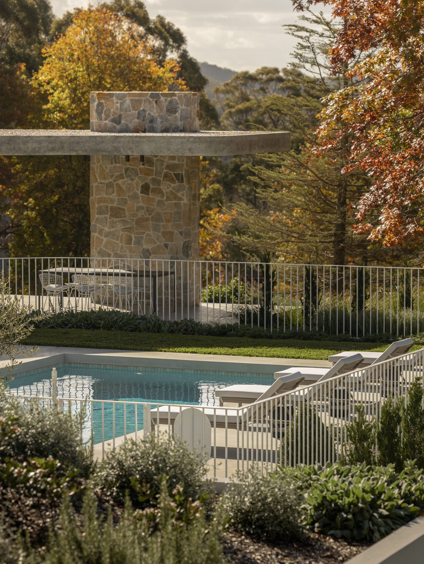 Pool and stone-clad outdoor pavilion at Melody House overlooking the Southern Highlands